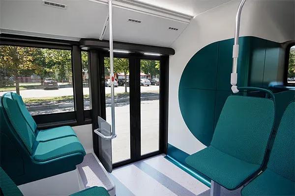 Switch Mobility e1 electric bus interior with spacious passenger seating, low-floor design and wide entry door
