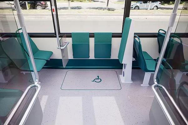 Switch Mobility e1 electric bus interior with wheelchair accessible passenger area and priority seating