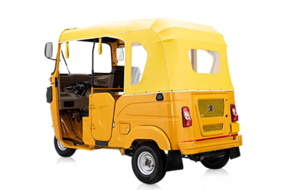 Bajaj RE Golden Yellow Left Rear Three Quarter Bajaj RE Golden Yellow Left Rear Three Quarter