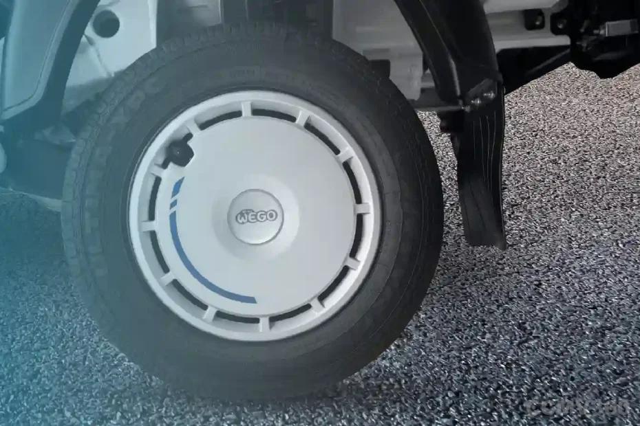 Bajaj WEGO C90 electric three-wheeler rear wheel and tyre close-up Bajaj WEGO C90 electric three-wheeler rear wheel and tyre close-up