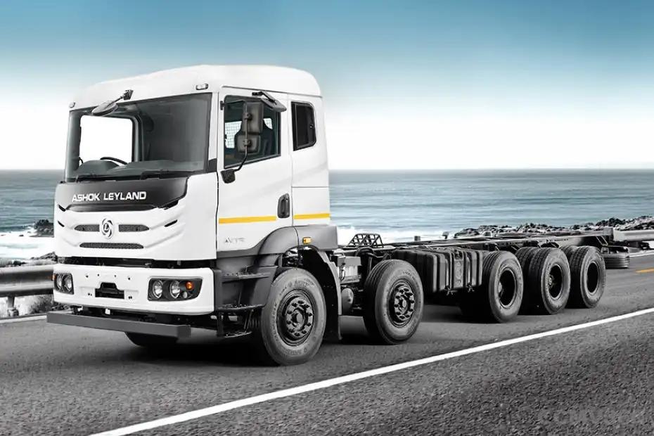 Ashok Leyland AVTR 4925H DTLA white truck on coastal road - front three-quarter view Ashok Leyland AVTR 4925H DTLA white truck on coastal road - front three-quarter view