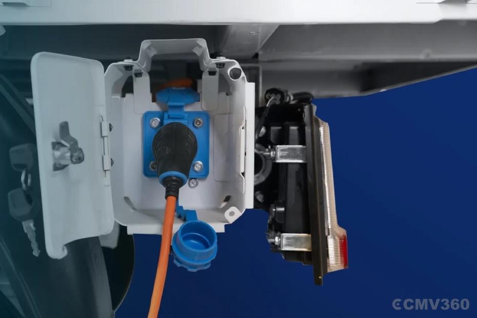 Bajaj WEGO C90 electric three-wheeler charging socket and power connection close-up Bajaj WEGO C90 electric three-wheeler charging socket and power connection close-up