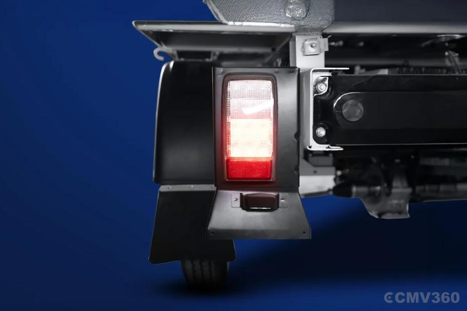 Bajaj WEGO C90 electric three-wheeler rear tail light and cargo chassis close-up Bajaj WEGO C90 electric three-wheeler rear tail light and cargo chassis close-up
