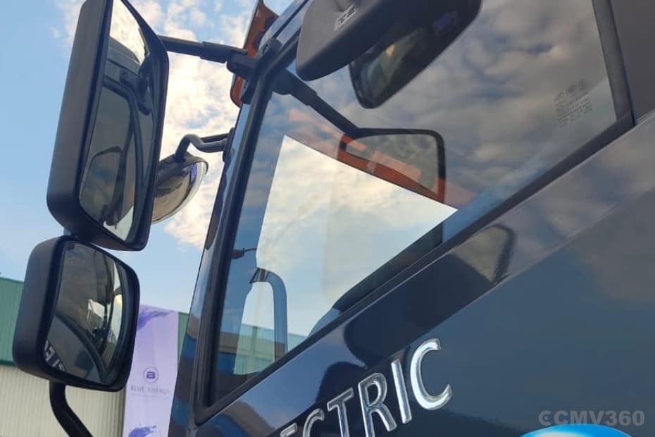 Blue Energy 5548e EV electric truck side mirrors and cabin close-up Blue Energy 5548e EV electric truck side mirrors and cabin close-up