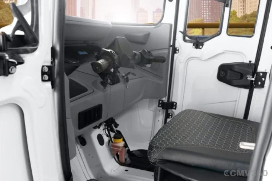 Bajaj WEGO C90 electric three-wheeler cabin interior with driver controls and seat Bajaj WEGO C90 electric three-wheeler cabin interior with driver controls and seat