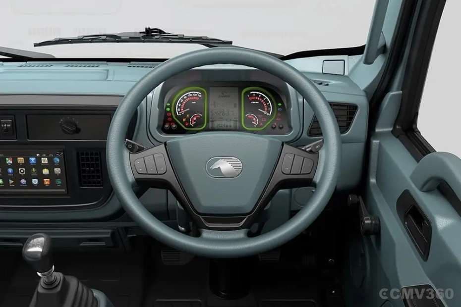 Driver-centric cabin with multifunction steering wheel Driver-centric cabin with multifunction steering wheel