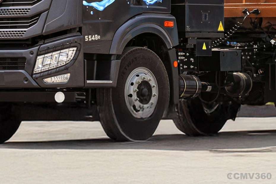 Blue Energy 5548e EV electric truck front wheel and axle assembly close-up Blue Energy 5548e EV electric truck front wheel and axle assembly close-up