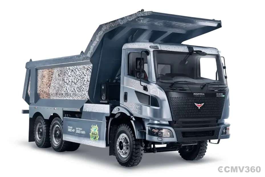 Montra Electric Rhino 2838EV electric tipper truck rear right quarter view with raised body and rugged off-road tyres Montra Electric Rhino 2838EV electric tipper truck rear right quarter view with raised body and rugged off-road tyres