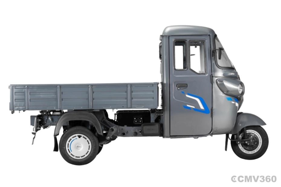 Bajaj WEGO C90 electric three-wheeler side profile with grey cargo load body Bajaj WEGO C90 electric three-wheeler side profile with grey cargo load body