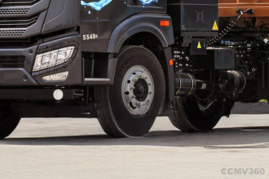 Blue Energy 5548e EV electric truck front wheel and axle assembly close-up Blue Energy 5548e EV electric truck front wheel and axle assembly close-up